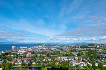 a view on the city with clouds over it on a summer day