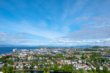 a view on the city with clouds over it on a summer day