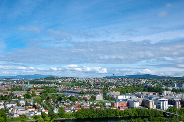 Fototapeta premium Panorama of the city in Norway from above with clouds over the sky