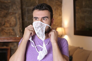 Sensual man smelling female underwear 