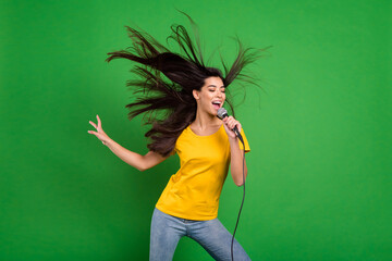 Photo portrait of overjoyed girl with long brunette hair singing karaoke at party isolated vibrant...