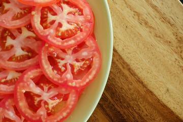 Sliced fresh tomatoes in a plate.