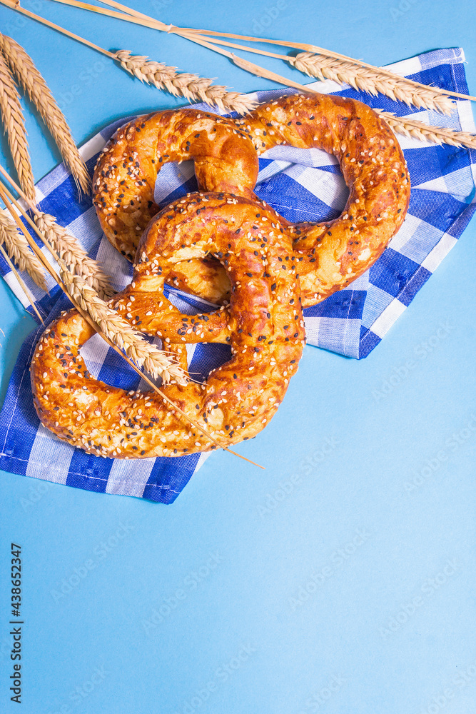 Wall mural Oktoberfest concept - pretzels on a traditional napkin