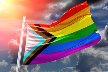 Flag of New LGBT rise waving to the wind with sky in the background the New Pride Flags