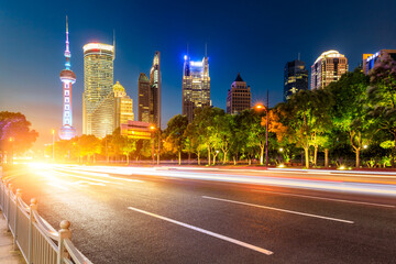 Fototapeta na wymiar Empty asphalt road and Shanghai architectural landscape skyline famous in China