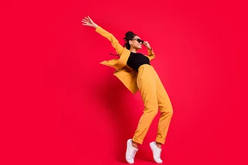 Fotobehang Full size profile photo of funny lady dance wear eyewear yellow suit isolated on vivid red color background © deagreez
