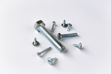 lots of silver bolts on a white background