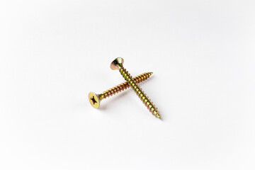 two long self-tapping screws on a white background