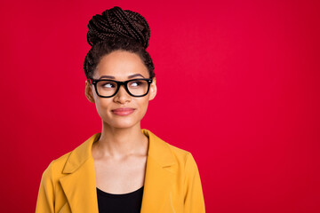 Photo of pretty business lady look empty space wear eyewear yellow cardigan isolated on vivid red color background