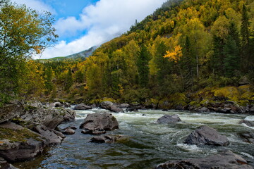 Russia. South Of Western Siberia, Altai Mountains. Early autumn on the mountain river Chulcha (a tributary of the Chulyshman River) near the Uchar waterfall.