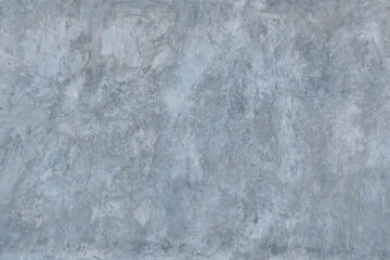 The background and texture of the gray cement plaster wall has an interesting pattern