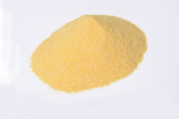 pile of grainy cornmeal texture on white background