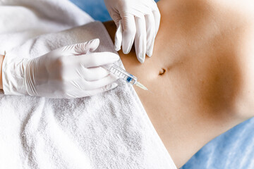 Beauty shots in the stomach for recovery by a doctor at the clinic. The concept of self-care - obrazy, fototapety, plakaty