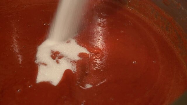 Add sugar to Jam of European Cornel in a pot (Cornus mas) - (4K)