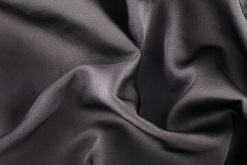 Plakat background black silk fabric close-up