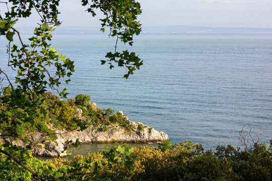Dante's rock on the Adriatic sea, in front of Duino Castle on the Trieste coast, Italy