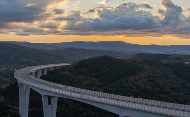 Fototapeta na wymiar The Črni Kal Viaduct, Slovenia. Photo of the highway at the sunset. 