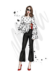 Beautiful high in pants and a shirt. Stylish clothes and accessories. Fashionable woman. Vector illustration. Fashion and Style. Fashion look.  - 438667384