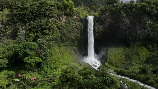 Aerial still video looking at a magnificent waterfall with a stunning amount of water falling to the bottom every second