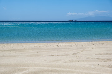 Fototapeta na wymiar Sandy beach, ocean sea water, summer vacations concept