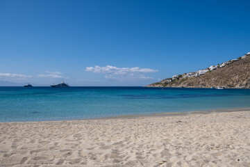 Obraz premium Mykonos island, Cyclades. Greece. Psarou sandy beach, summer holidays concept