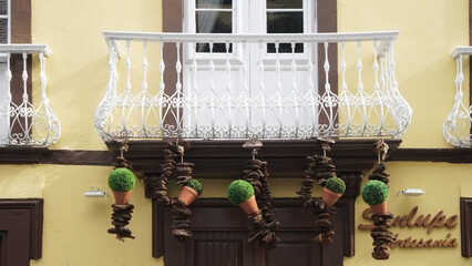 traditional, aristocratic balcony in Arabic style, decorated with many flowers. In the Canary...