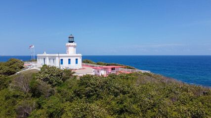 Fototapeta na wymiar The Arecibo Lighthouse or Faro de los Morrillos is a historic lighthouse located in the city of Arecibo, Puerto Rico. Its name comes from its location on a rocky promontory called Punta Morrillos.
