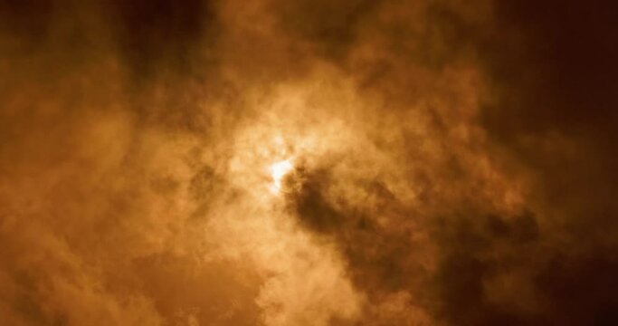 Partial Solar eclipse 10 june 2021 4K video from 8K footage. Moon moves between Sun and Earth partially blocking Sun light. Beautiful dramatic clouds skies movement. Solar eclipse, astronomy science 