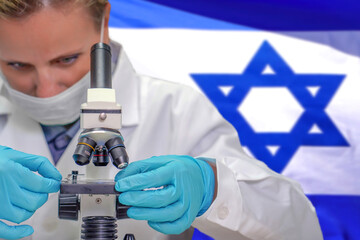 Female biochemist looking through a microscope against Israel flag background. Medical technology...