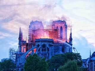 Notre Dame de Paris on fire during the evening.