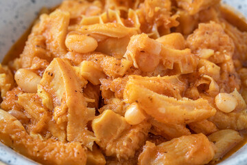 Close up of stewed tripe with beans.