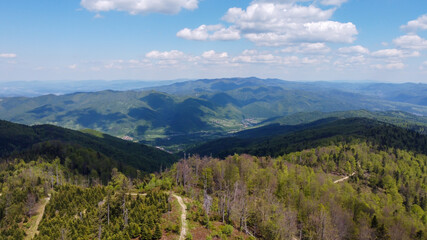 Fototapeta na wymiar Luban (Lubań) highest mountain peak in polish Gorce - observation tower - view frome drone