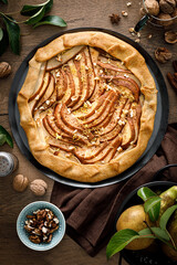 Pear galette with walnuts, cinnamon and lemon zest, autumn fruit pie with nuts