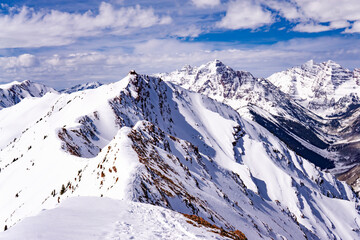 Fototapeta na wymiar Epic High Altitude Extreme Mountain Summit Snow Capped Landscape