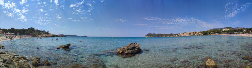 Fototapeta na wymiar Panorama seacoast of the beach in mallorca with beaturiful view of the sea. Sea view of turquoise colour. Concept of summer, travel, relax and enjoy