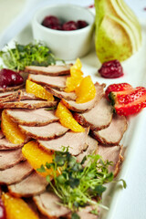 plate of cold cuts appetizers on a light background