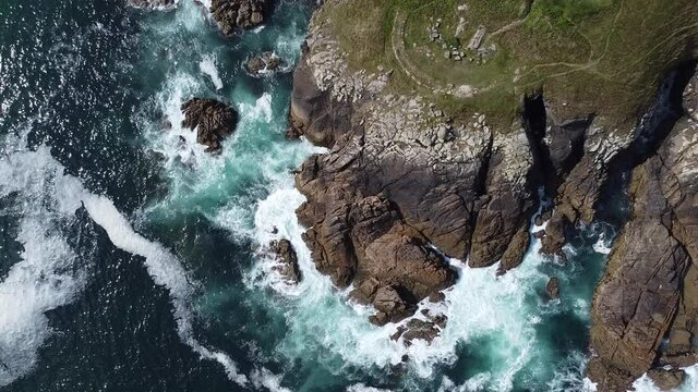 Aerial view of the cliffs with the rough sea in Ferrol, Galicia, Spain. Saint George's beach.