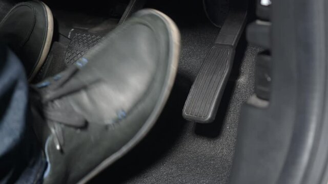 Car foot pedal. Accelerator and break pedal in a car. Close up the foot pressing foot pedal of a car to drive. Driver driving the car by pushing accelerator pedals of the cars. inside vehicle. auto.