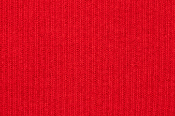 Texture of natural red striped wool close-up. fabric for a warm sweater. the background for your mockup