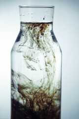Bottle with water, ink and oil