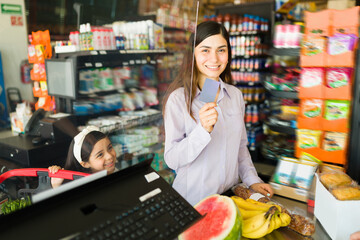 Attractive woman at the checkout counter
