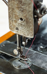 Sewing machine with sewing thread.
