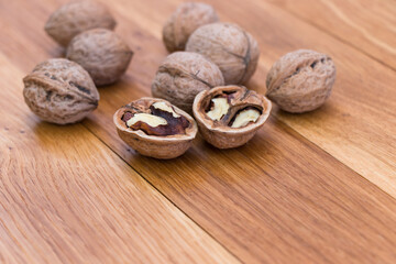 Stack Walnuts on wooden background. Walnut kernels close-up.