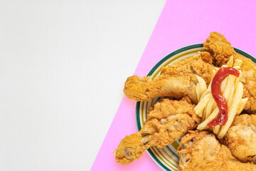 Background with fried chicken legs. Vintage template on the theme of fast food with an empty place for text or menu.