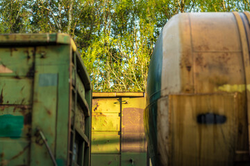 A freight train is temporarily parked in the forest. Tanks on the railway.