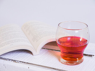 glass of wine and book