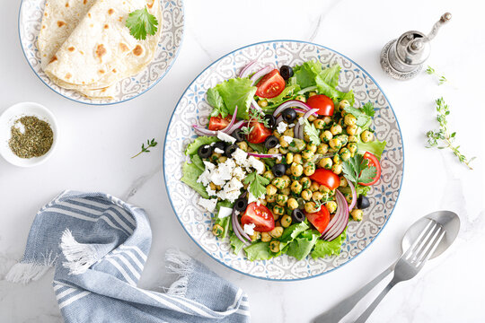 Mediterranean Greek And Chickpea Salad With Fresh Vegetables And Feta Cheese, Top View