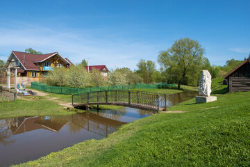 Ukhtanka River in the village of Vyatskoye, Yaroslavl region on a sunny day.