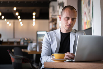 Fototapeta na wymiar Businessman working laptop office and drinking caffee