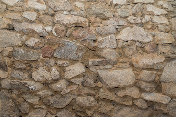 Steinwand einer alten Hausmauer